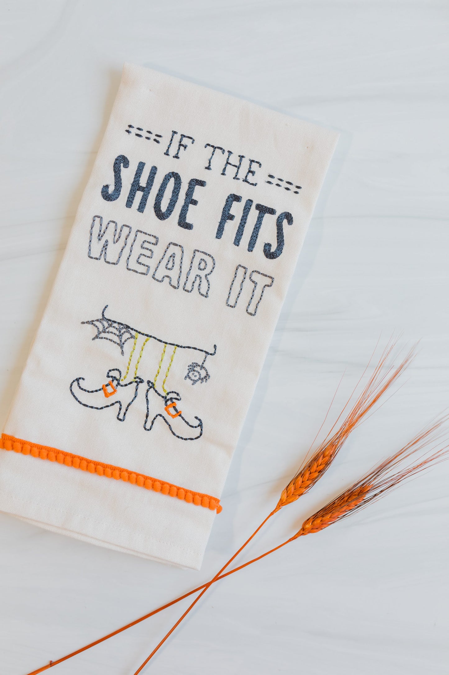 "If the shoes fits" tea towel